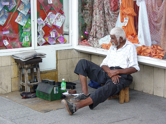A shoeshine man waits for a customer, Salta